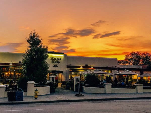 Wicked Weed Brewing in Asheville, NC with orange and yellow sunset