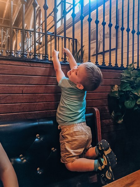 Small child in booth at Stable Cafe