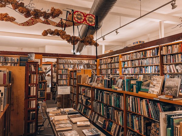 The Captain's Bookshelf Asheville Used Bookstore with inside of the bookstore lined with bookshelves filled with older and used books