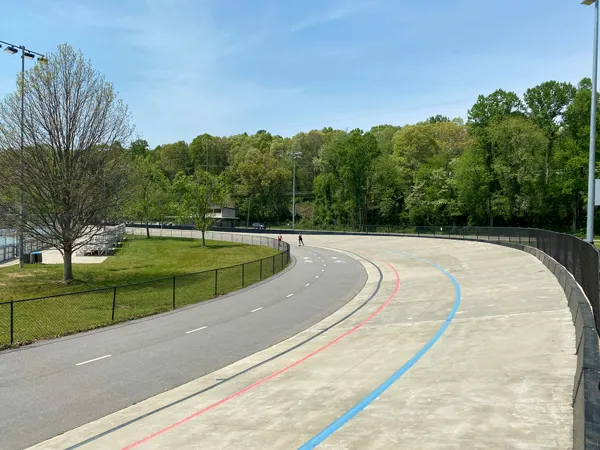 Carrier Park Asheville NC velodrome with paved lanes for walking and bike riding with trees and recreation area in the middle