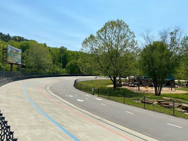 Carrier Park Asheville NC with velodrome with paved lanes for walking and bike riding with trees and recreation area in the middle