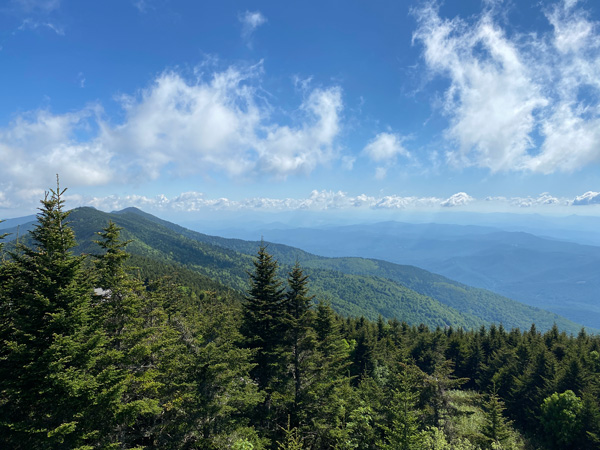 Mount Mitchell Hiking Trails with blue and green mountains with trees