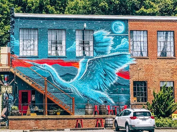 Asheville NC Things To Do River Arts District Heron mural on brick building