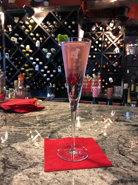 Battery Park Book Exchange Champagne Book Bar Asheville NC cocktail in champagne glass