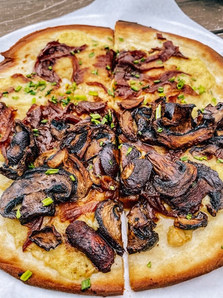 Grata Pizzeria UpCountry Brewing West Asheville sliced pizza with mushrooms