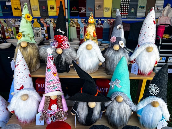 Maggie Valley Arts and Crafts Festival Vendors with two levels of handcrafted gnome dolls with different colors and designs