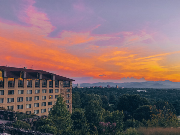 Purple, orange, and pink sunset over the Blue Ridge Mountains at The Omni Grove Park Inn in Asheville, North Carolina