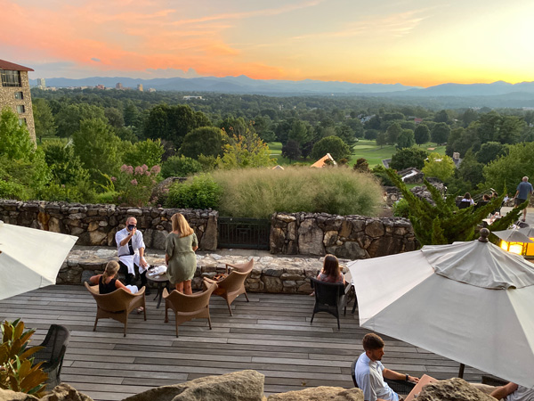 Sunset Terrace sunset and tables at Omni Grove Park Inn