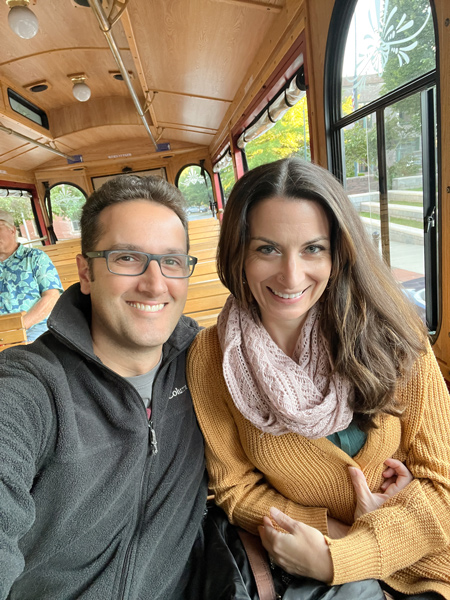 Gray Line Trolley Tours Asheville NC with white brunette male and female warmly dressed on trolley