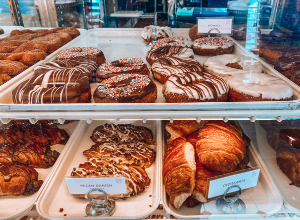 Asheville donuts Geraldines Bakery with display case full of donuts and pastries