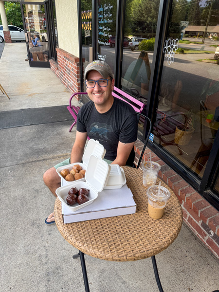 Tom with to-go gluten free Dough House donuts