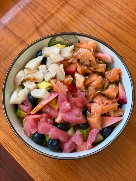 Fruit Sushi Salad at Mr Sushi Asheville with tuna, salmon, lettuce, strawberries, and blueberries