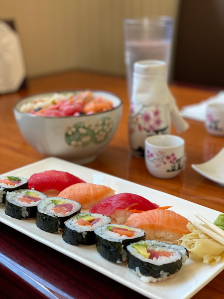 Sushi Rolls, Sashimi, sake glasses, and Poke salad from Mr. Sushi in Asheville, NC