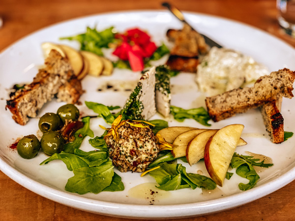 Cheese Plate Plant Asheville NC with olives, vegan cheeses, beets, and bread