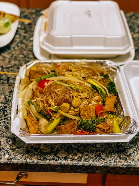 Siam Thai Food Asheville with takeout container filled with brown noodles