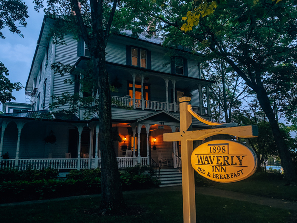 1898 Waverly Inn Hendersonville NC Bed and Breakfast white house with gray blue shutters at night