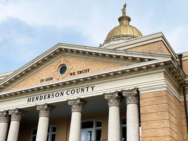 Hendersonville County Courthouse Hendersonville NC with tan historic building with white columns