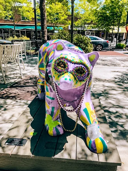 Historic downtown Hendersonville Mardi Gras purple bear sculpture