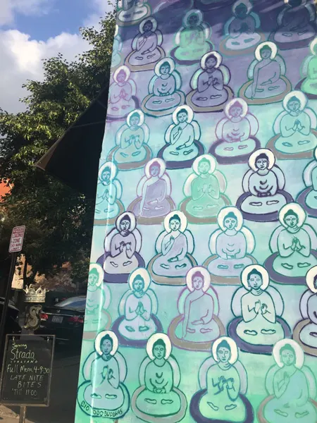 10000 Buddhas Asheville Murals with blue purple and green buddhas
