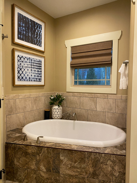 Bathtub Asheville Cottages with beige walls and tiles