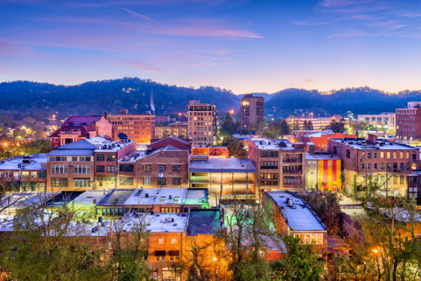 Best Asheville Neighborhoods Downtown cityscape at night