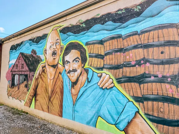 Burial-Beer-Co-Tom-Selleck-Sloth-Mural-Asheville.jpg.webp