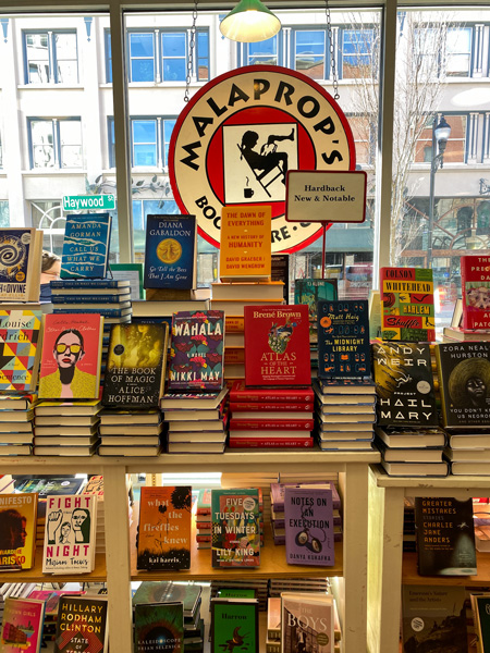 Malaprop's Bookstore In Asheville NC with table filled with books at Malaprop's Bookstore in Downtown Asheville