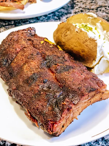 Bear's Smokehouse BBQ Asheville Takeout with half rack ribs and baked potato