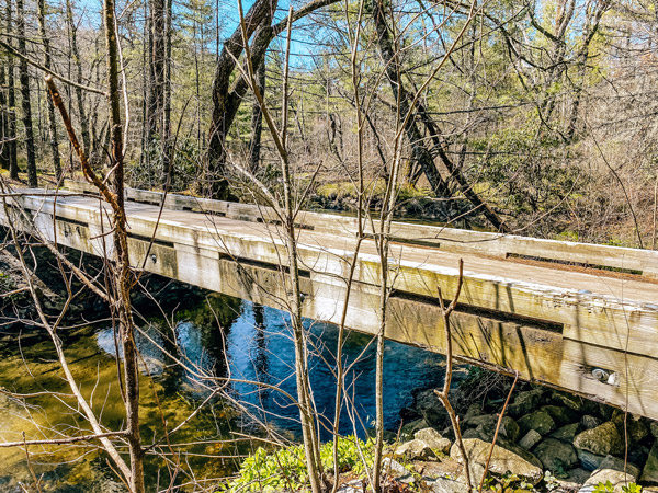 Pink Beds Hike Pisgah Forest NC with wooden bridge over water