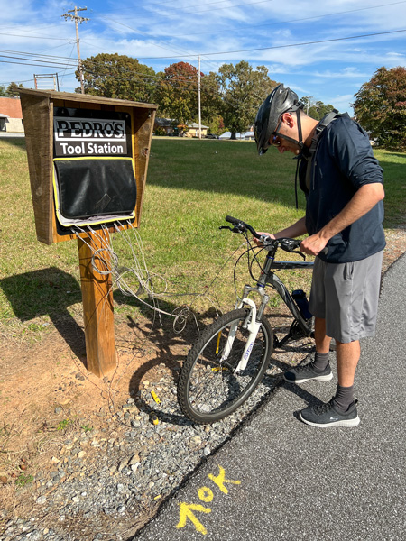 Tom with bike at tool station