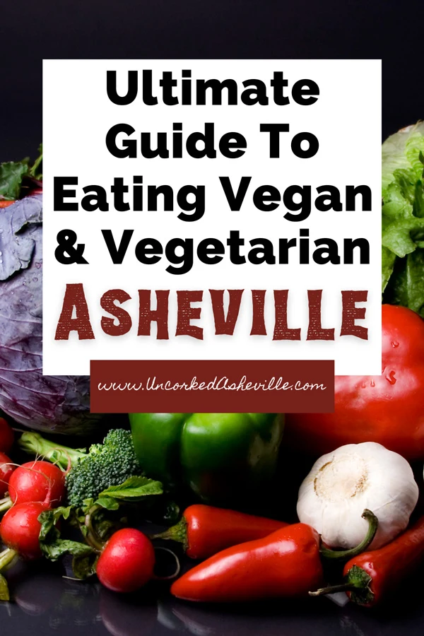 Vegetarian Vegan Asheville Guide Pinterest Pin with picture of raw vegetables like carrots, garlic, tomatoes, peppers, and lettuce