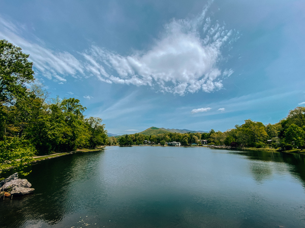 The Seven Sisters Black Mountain North Carolina with Lake Tomahawk and 7 mountain peaks behind the lake with green trees