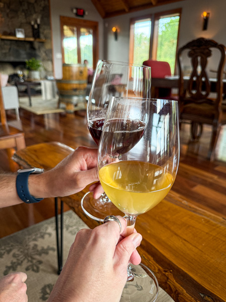 Wine glass cheers at Addison Farms Vineyard