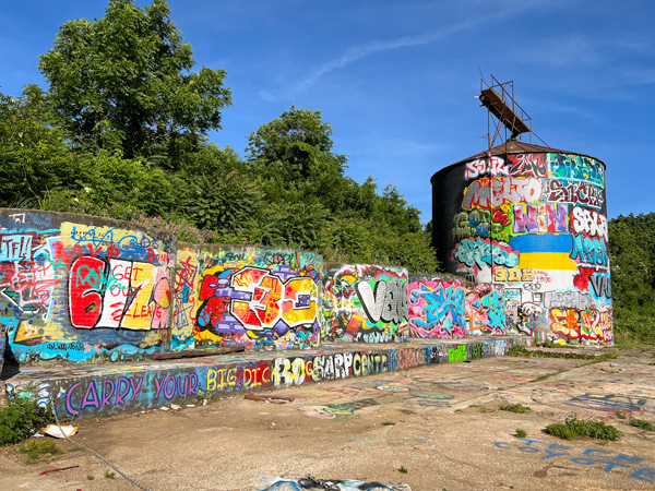 Asheville Silo in the River Arts District with large silo painted with colorful tags and street art