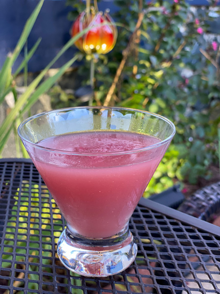 Pink Cocktail on table at Green Tea Sushi Asheville NC