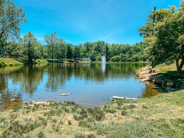 Lake Louise Park Weaverville NC with man-made lake, fountain in lake, and trees