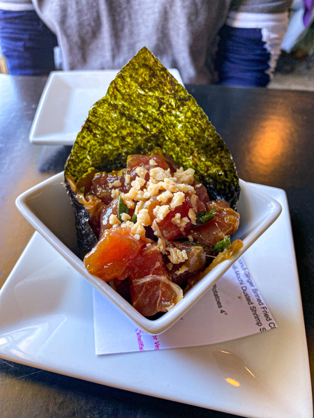 RosaBees Restaurant Asheville River Arts District with bowl of raw tuna in seaweed rice paper in white bowl on table