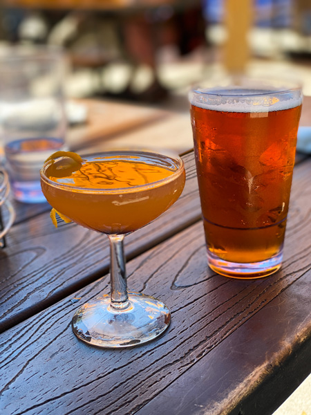 Sunny Point Cafe West Asheville Cocktails with amber beer and cocktail in martini glass