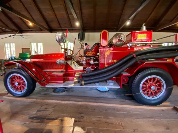 Asheville Estes-Winn Antique Car Museum old red fire truck on wooden showroom floor