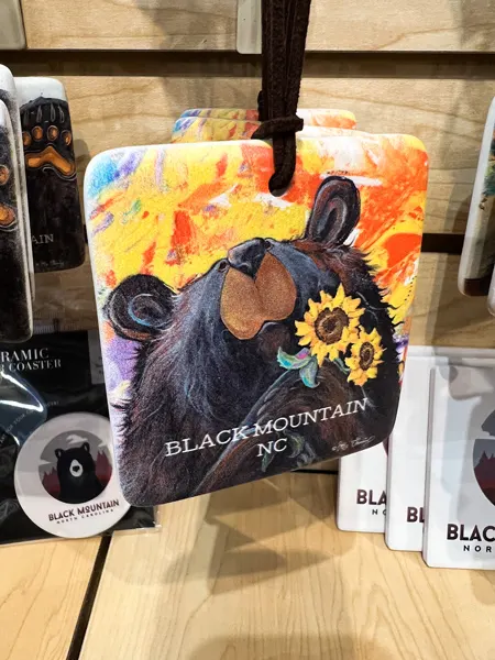 CW Moose Trading Company Black Mountain Shop with handcrafted black bear ornament with sunflowers