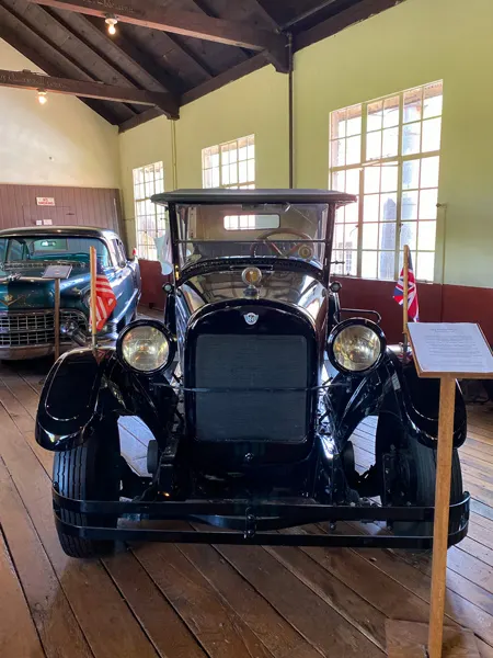 Estes-Winn Antique Car Museum Asheville, NC black older car with two big headlights at top of wheels