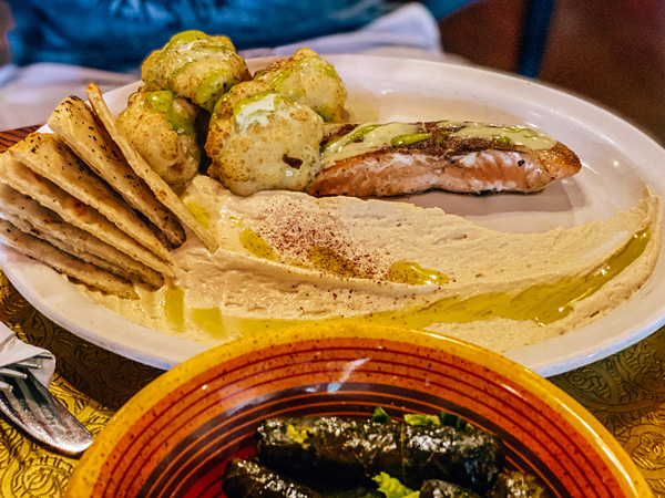 Jerusalem Garden Cafe Downtown Asheville gluten-free entree of salmon, hummus, pita, and grape leaves