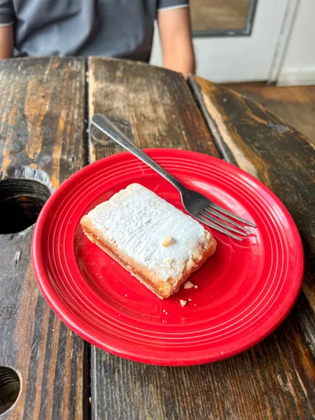 Odd's Cafe in Asheville NC with gluten-free and vegan and dairy-free white bar on red plate with fork