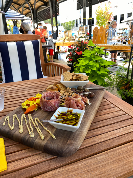 Battery Park Book Exchange Champagne Bar Charcuterie with meats, mustard, and crackers