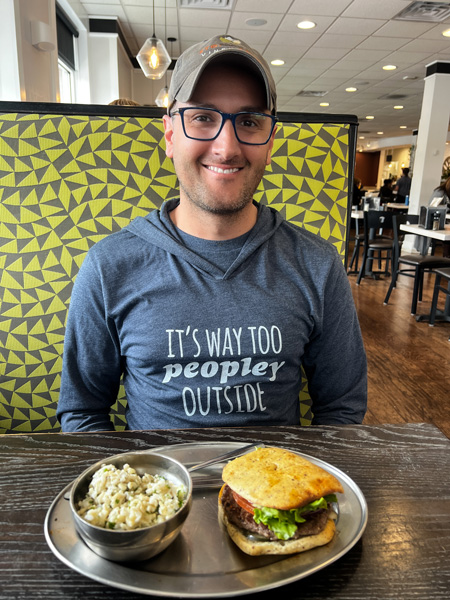 Tom with Green Sage Cafe sandwich