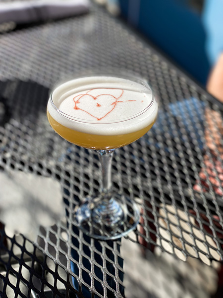 Isa's French Bistro Downtown Asheville Cocktail with heart on top in martini glass