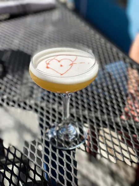 Isa's French Bistro Downtown Asheville Cocktail with heart on top in martini glass