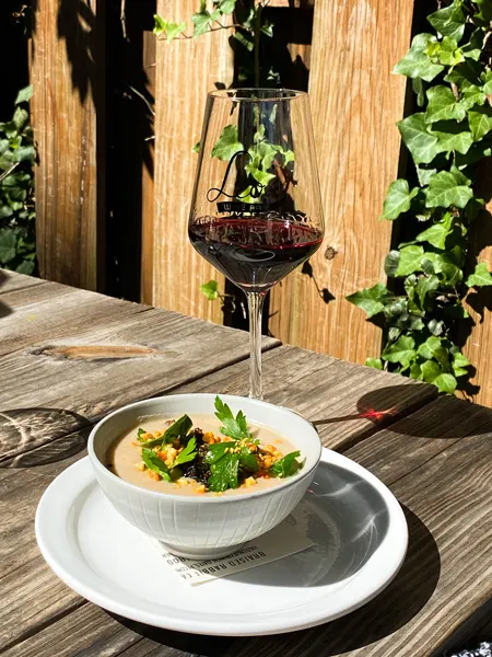 Leos House Of Thirst Sunday Brunch Asheville NC bowl of cauliflower soup with glass of red wine