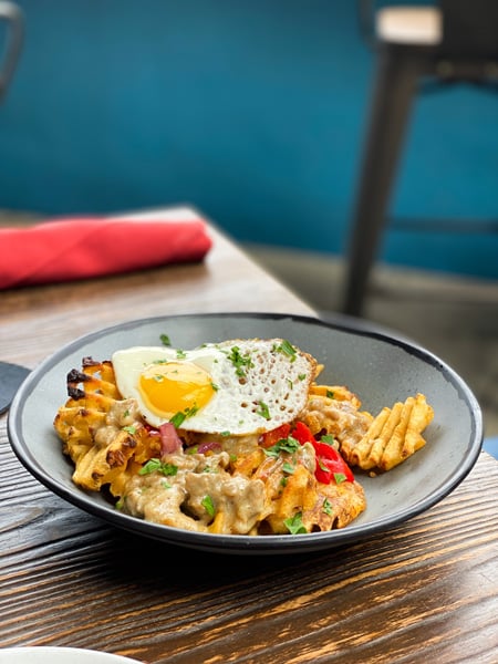 Sunday Brunch with southwestern egg bowl with peppers and waffle fries at Social Lounge in Asheville, NC