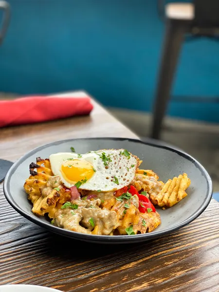 Social Lounge Asheville Sunday Brunch with southwestern egg bowl with peppers and waffle fries